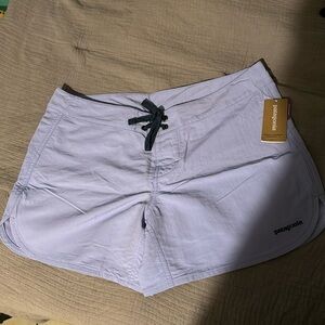 Patagonia light violet blue women’s wave farer board shorts.